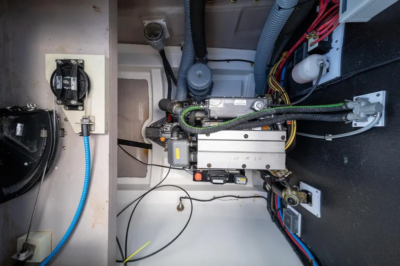 Cat Tales Yacht Photos Pics Engine compartment of a 2022 Bali 4.2 yacht, showcasing wiring and mechanical components.