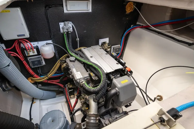 Cat Tales Yacht Photos Pics Engine compartment of a 2022 Bali 4.2 boat, showcasing wiring and mechanical components.