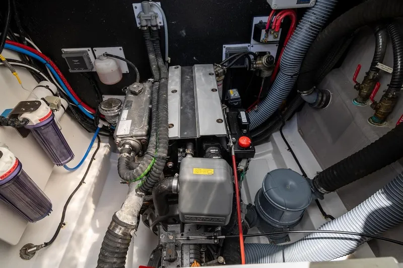 Cat Tales Yacht Photos Pics Engine compartment of a 2022 Bali 4.2, showcasing mechanical components and wiring.