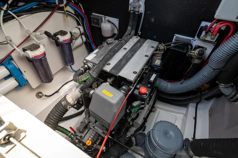 Cat Tales Yacht Photos Pics Engine room of a 2022 Bali 4.2 boat, showcasing mechanical components and wiring.