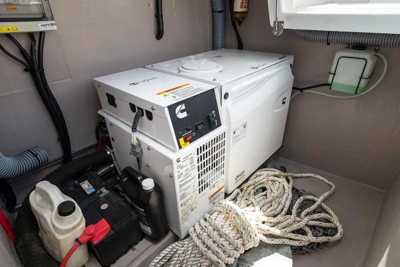 Cat Tales Yacht Photos Pics Engine room of a 2022 Bali 4.2 yacht with generator and ropes.