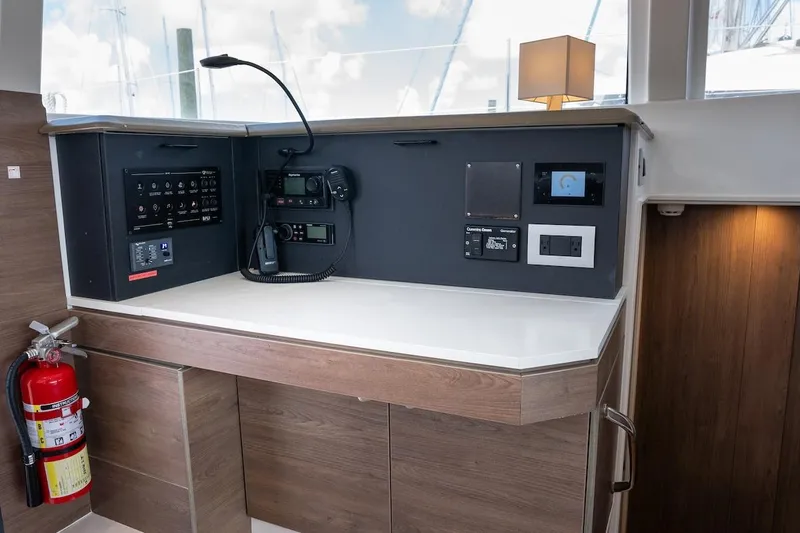Cat Tales Yacht Photos Pics Control panel on a 2022 Bali 4.2 yacht, featuring navigation and communication equipment.