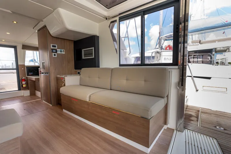 Cat Tales Yacht Photos Pics Interior of 2022 Bali 4.2 yacht with modern seating and wooden flooring.
