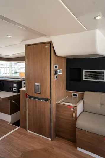 Cat Tales Yacht Photos Pics Interior of 2022 Bali 4.2 yacht with modern wood finish and seating area.