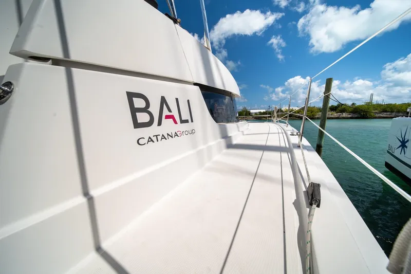 Cat Tales Yacht Photos Pics Bali 4.2 catamaran deck, 2022 model, with clear blue sky and water view.