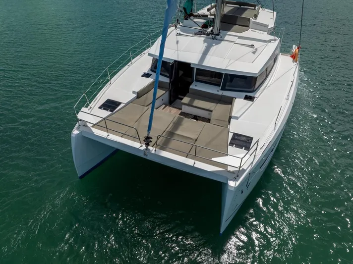 Cat Tales Yacht Photos Pics 2022 Bali 4.2 catamaran on calm water, aerial view.