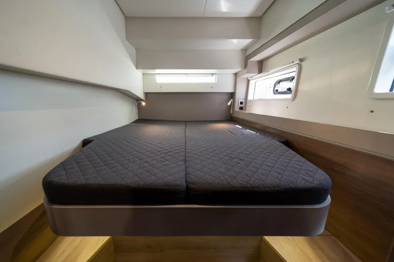 Cat Tales Yacht Photos Pics Interior cabin of a 2022 Bali 4.2 yacht with a comfortable bed.