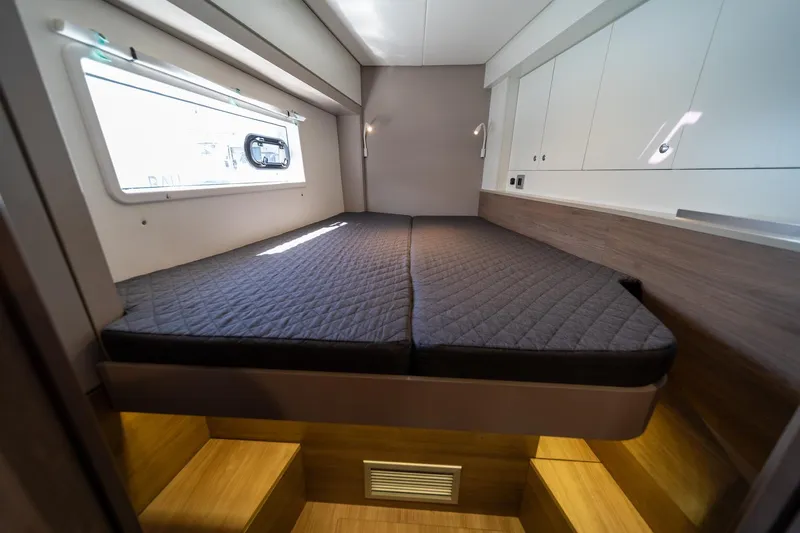 Cat Tales Yacht Photos Pics Interior cabin of a 2022 Bali 4.2 yacht with a comfortable bed and modern design.