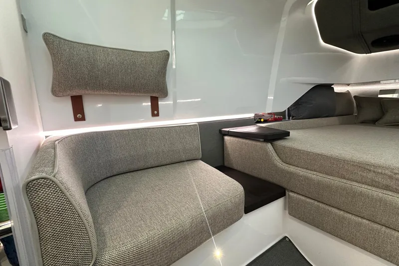  Yacht Photos Pics 2024 Axopar 37 Sun-Top interior with modern seating and sleek design.