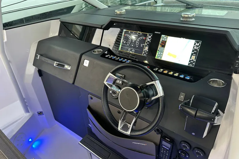  Yacht Photos Pics 2024 Axopar 37 Sun-Top helm with modern controls and digital displays.