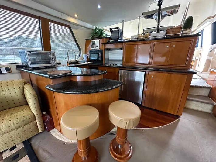 Yacht Photos Pics Luxurious kitchen area in 2001 Carver 570 Voyager Pilothouse yacht.