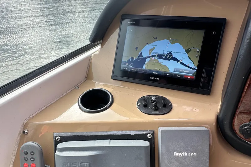  Yacht Photos Pics 2001 Carver 570 Voyager Pilothouse navigation system with Garmin display and Raytheon equipment.