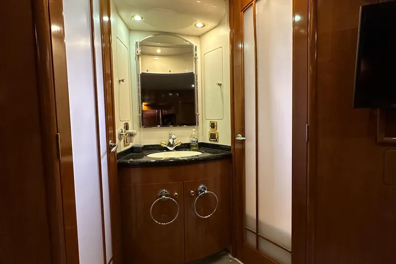  Yacht Photos Pics Luxurious bathroom in 2001 Carver 570 Voyager Pilothouse yacht with wooden cabinetry.
