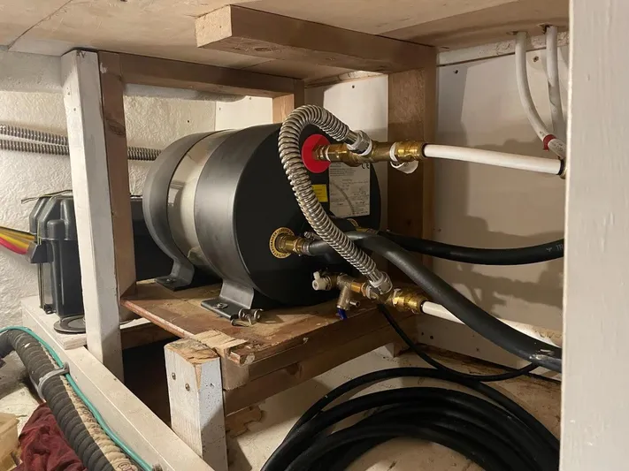 Sea Prince III Yacht Photos Pics Engine room of a 2010 Custom Trawler with visible piping and equipment.