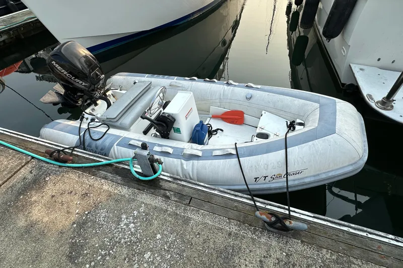 Sunchaser Yacht Photos Pics Inflatable boat with Mercury motor docked, Hampton 490 model, 1999.