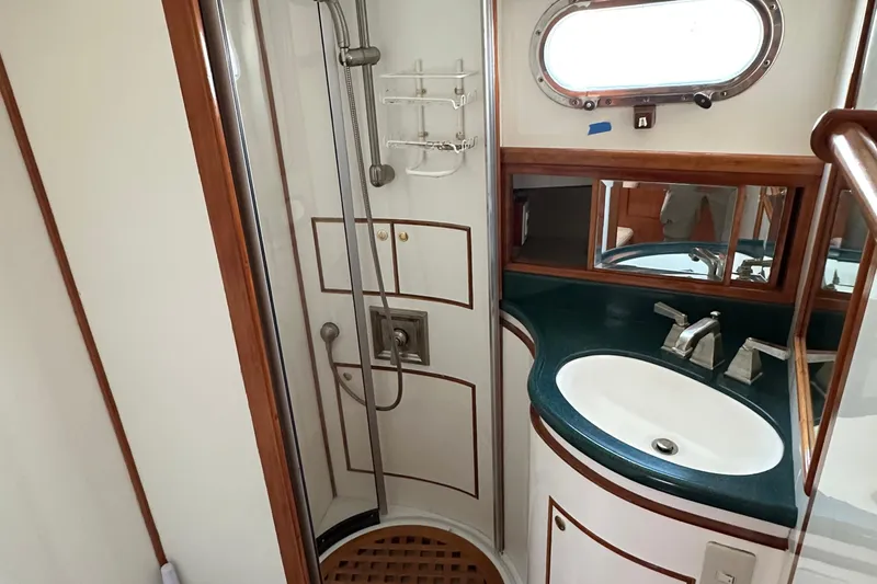 Sunchaser Yacht Photos Pics Bathroom interior of 1999 Hampton 490 yacht with shower and sink.