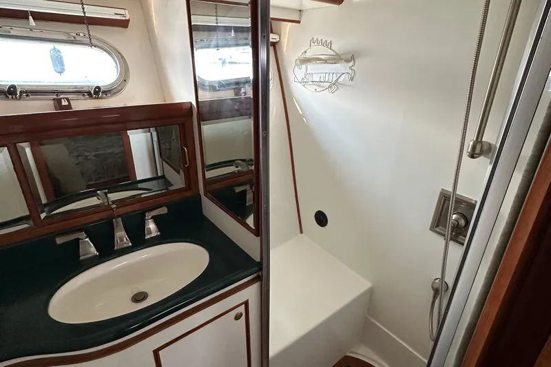 Sunchaser Yacht Photos Pics Bathroom interior of 1999 Hampton 490 yacht with sink and shower.