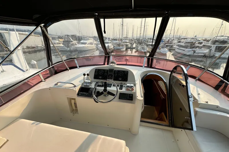 Sunchaser Yacht Photos Pics Cockpit view of a 1999 Hampton 490 yacht docked at a marina.