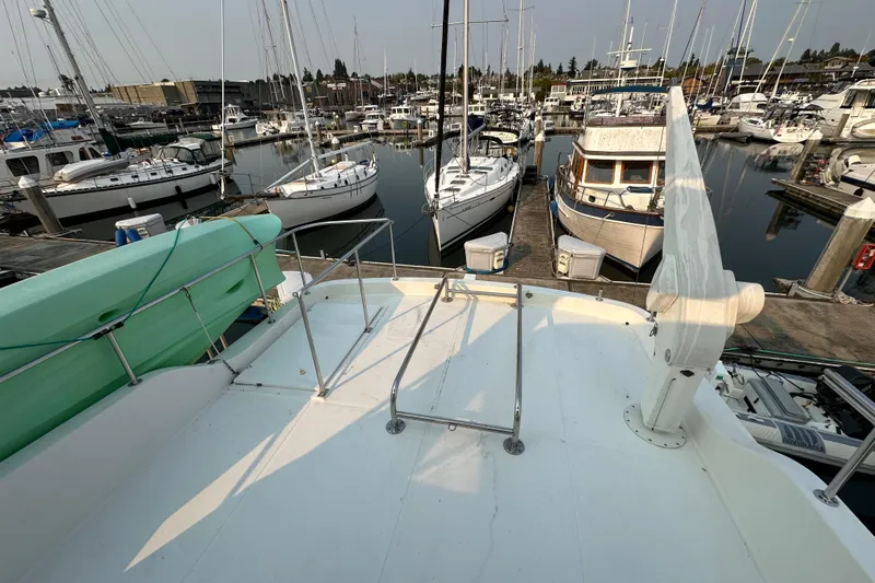 Sunchaser Yacht Photos Pics 1999 Hampton 490 yacht docked at marina with surrounding boats.