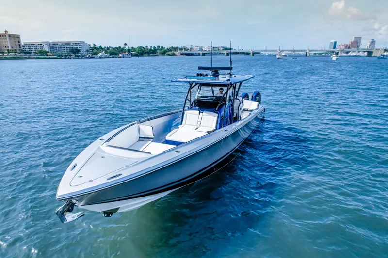  Yacht Photos Pics 2022 Nor-Tech 390 Center Console boat cruising on a sunny day.