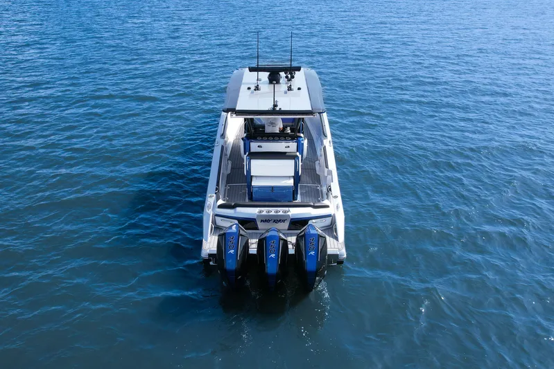  Yacht Photos Pics 2022 Nor-Tech 390 Center Console boat on open water, rear view.