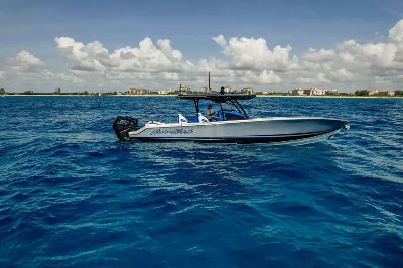  Yacht Photos Pics 2022 Nor-Tech 390 Center Console boat cruising on blue ocean waters.