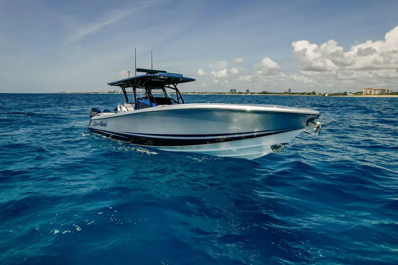  Yacht Photos Pics 2022 Nor-Tech 390 Center Console boat cruising on open blue ocean under clear sky.