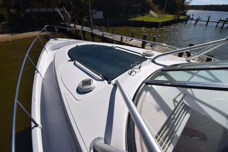 Tie Me Up Yacht Photos Pics 2005 Donzi 38 ZSF boat docked by a scenic waterfront.