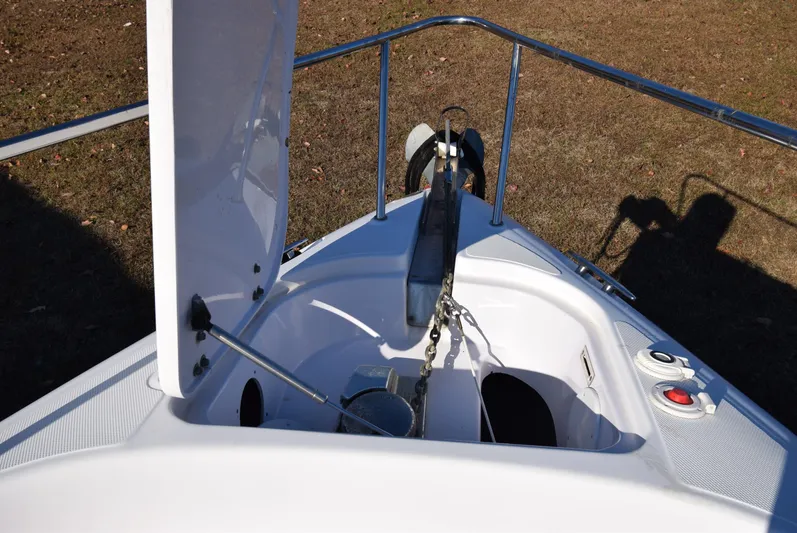 Tie Me Up Yacht Photos Pics 2005 Donzi 38 ZSF boat anchor compartment with open hatch and chain mechanism.