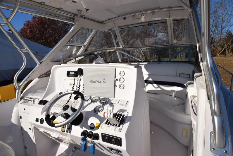 Tie Me Up Yacht Photos Pics 2005 Donzi 38 ZSF boat cockpit with Garmin navigation system and steering wheel.