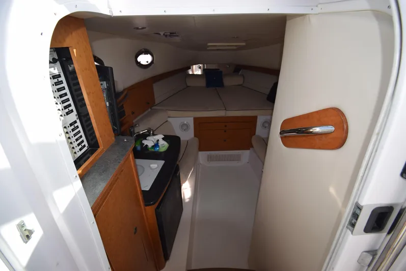 Tie Me Up Yacht Photos Pics 2005 Donzi 38 ZSF cabin interior with kitchenette and seating area.