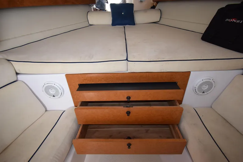 Tie Me Up Yacht Photos Pics Interior cabin of 2005 Donzi 38 ZSF boat with storage drawers and cushioned seating.