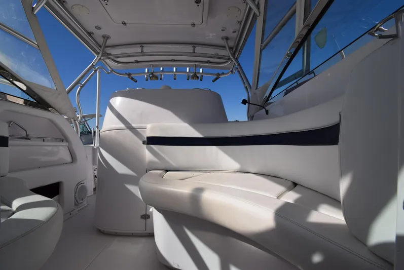 Tie Me Up Yacht Photos Pics Interior of a 2005 Donzi 38 ZSF boat with white seating and blue accents.