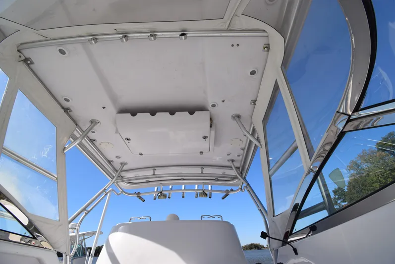 Tie Me Up Yacht Photos Pics 2005 Donzi 38 ZSF boat interior, showcasing helm and overhead structure with clear blue sky.