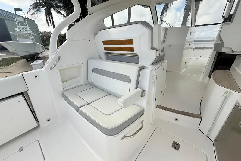 Salty Girl Yacht Photos Pics 2022 Pursuit DC 365 Dual Console interior with white seating and modern design.