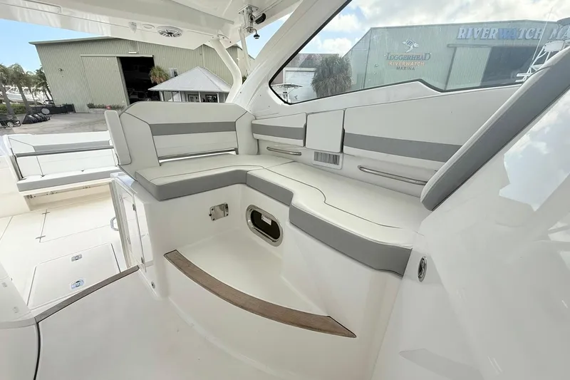 Salty Girl Yacht Photos Pics 2022 Pursuit DC 365 Dual Console boat interior with sleek seating and modern design.