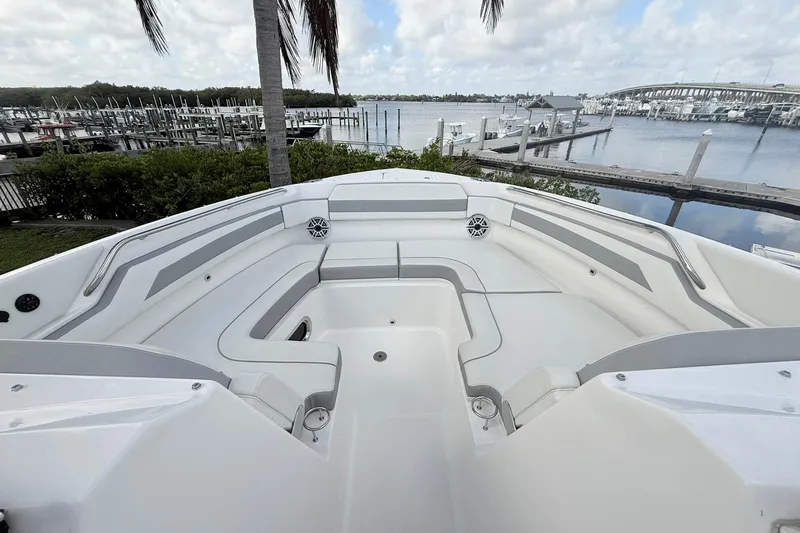 Salty Girl Yacht Photos Pics 2022 Pursuit DC 365 Dual Console boat interior with spacious seating, dockside view.