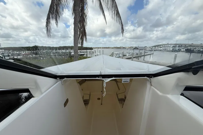 Salty Girl Yacht Photos Pics 2022 Pursuit DC 365 Dual Console boat docked with scenic marina view.