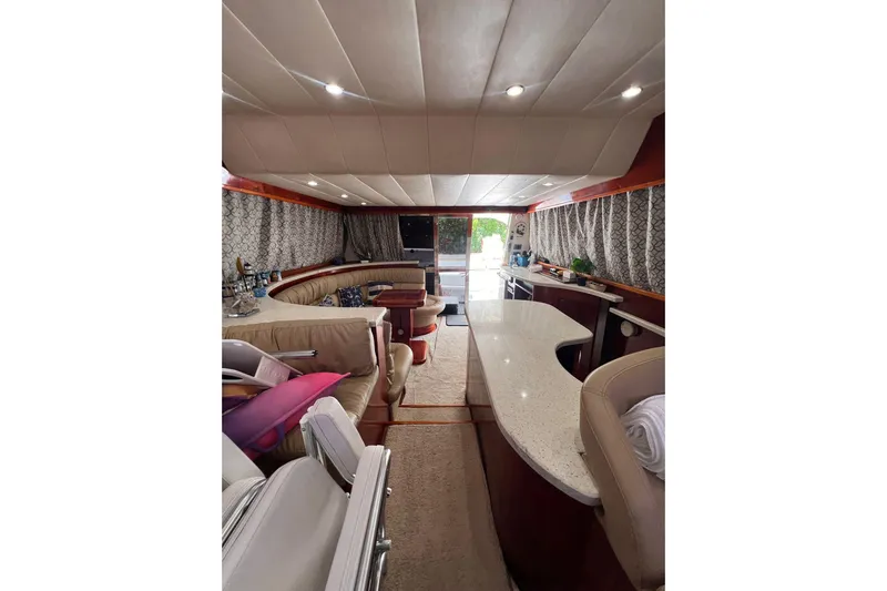 Nickys Yacht Photos Pics Luxurious interior of 2003 Uniesse 48 Fly yacht with elegant seating and modern amenities.