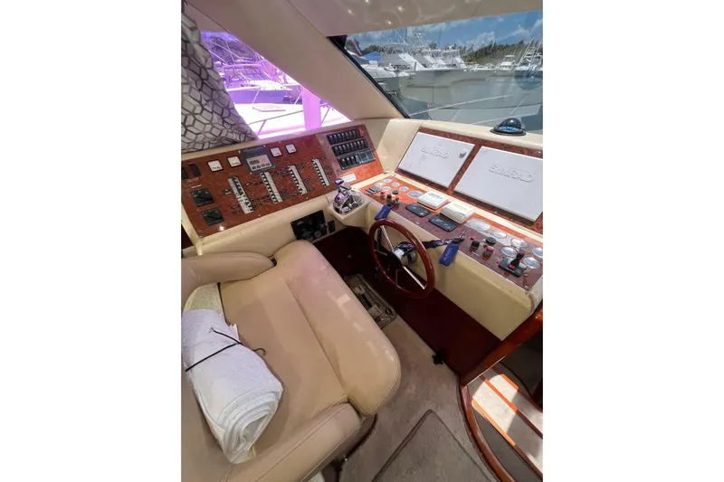 Nickys Yacht Photos Pics Luxurious 2003 Uniesse 48 Fly yacht helm with leather seating and advanced navigation controls.