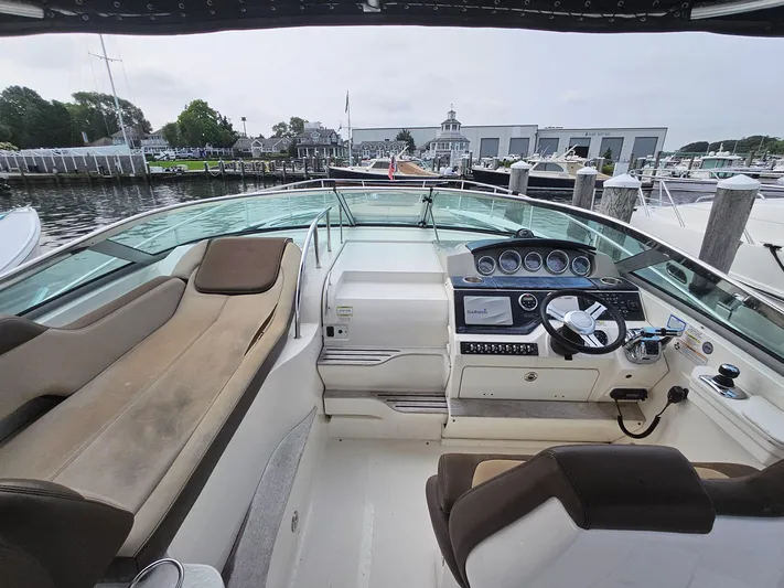 Knot On Call Yacht Photos Pics 2014 Sea Ray 350 Sundancer cockpit with helm, seating, and marina view.