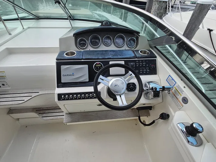 Knot On Call Yacht Photos Pics 2014 Sea Ray 350 Sundancer helm with Garmin navigation and modern controls.