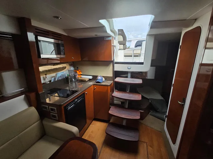 Knot On Call Yacht Photos Pics Interior of 2014 Sea Ray 350 Sundancer yacht with modern kitchen and seating area.