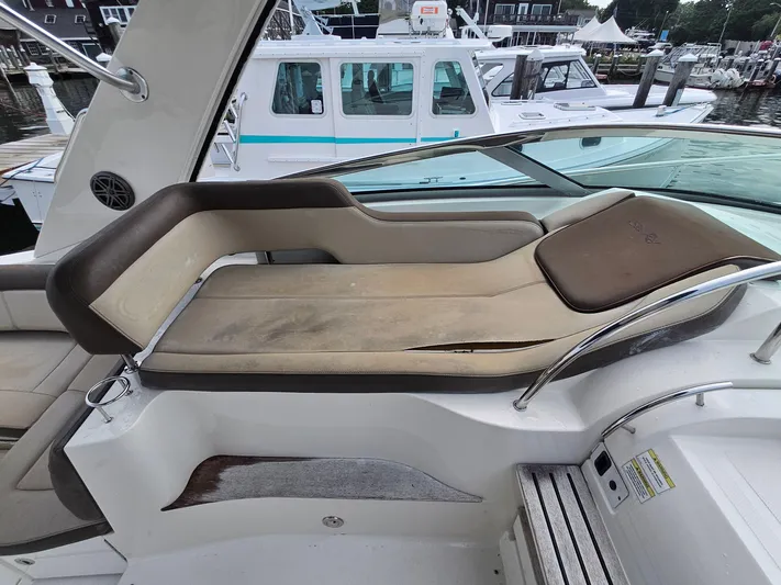 Knot On Call Yacht Photos Pics 2014 Sea Ray 350 Sundancer boat interior with cushioned seating and sleek design.