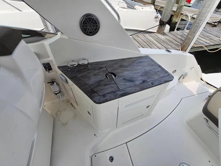 Knot On Call Yacht Photos Pics 2014 Sea Ray 350 Sundancer boat interior with sleek countertop and storage.
