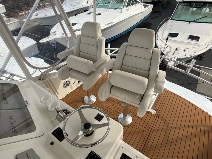 Split Decision Yacht Photos Pics Helm of 2005 Ocean Yachts 46 Super Sport with two captain's chairs.