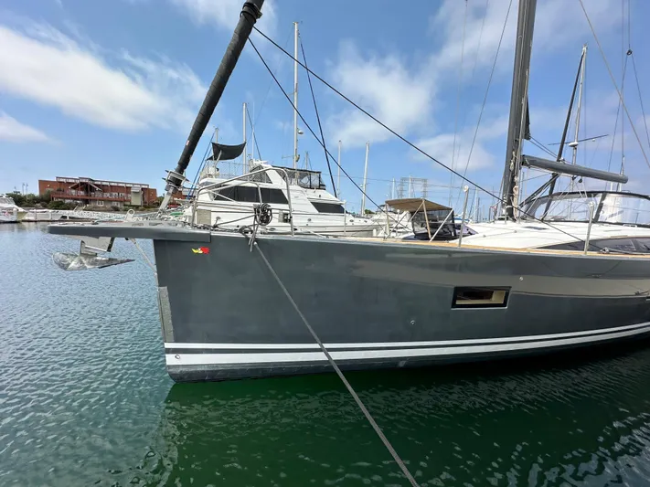 Edwina Yacht Photos Pics 2018 Jeanneau 54 yacht docked in marina, clear sky, calm water.