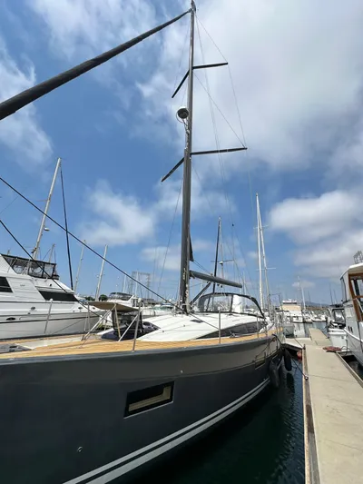 Edwina Yacht Photos Pics 2018 Jeanneau 54 yacht docked at marina under blue sky.