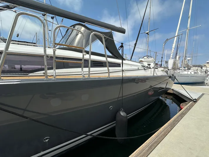 Edwina Yacht Photos Pics 2018 Jeanneau 54 yacht docked at marina, sleek design, clear blue sky.