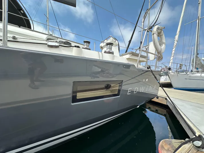 Edwina Yacht Photos Pics 2018 Jeanneau 54 sailboat "Edwina" docked at marina, side view.